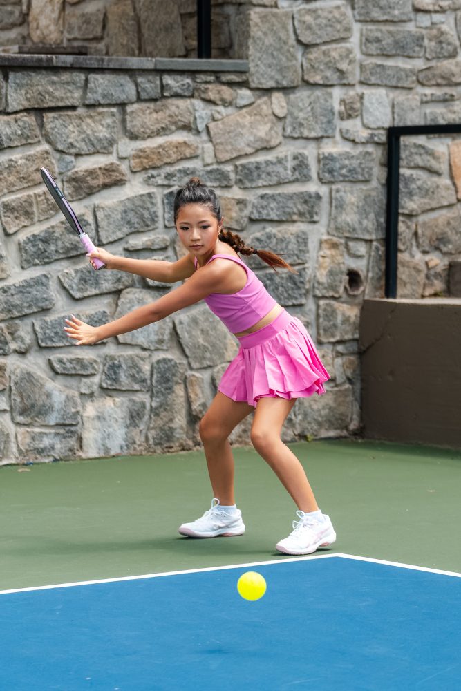 Ella Oh on court with the pink Friction Pro V2